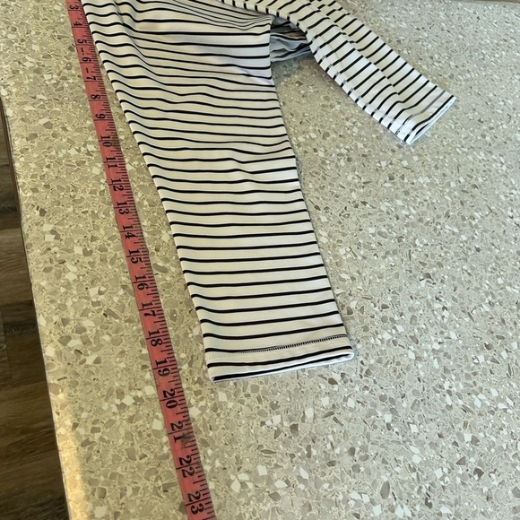 Scorpio Sol Luxury Performance Crop
Size S White Black Stripe - Picture 8 of 9